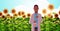 African american man scientist holding test tube making experiment on sunflowers field research science agriculture