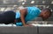 African american man sport training workout push ups outside