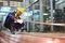 African American mechanic engineer worker is choosing copper tube for sawing while working in coolant factory