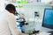 African-american medical doctor working in research lab. Science assistant making pharmaceutical experiments. Chemistry