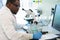 African-american medical doctor working in research lab. Science assistant making pharmaceutical experiments. Chemistry