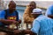 African American Men Play Chess Outdoors At Atlanta Public Park