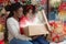 African american mom and daughter opening shining Christmas gift box