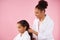 African American mother braids plait of little