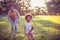 African American mother and daughter playing in nature. Focus on kid.   Ho is faster