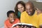 African American multicultural family reading The Bible.