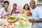 African American Parents Children Family Eating At Dining Table