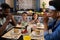 African american parents and children saying grace at dining table before breakfast in morning