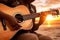 African american person\\\'s hands playing acoustic guitar on sandy beach at sunset time. Playing music concept, neural network