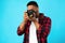 African American Photographer Taking Photo Standing On Blue Background