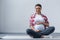 african american pregnant woman sitting