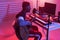 African american professional musician recording guitar in digital studio at home, music production technology concept.