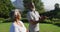 African american senior couple meditating together while standing in the garden