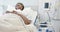 African american senior female patient sleeping in bed in hospital room, slow motion