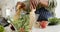 African american senior woman mixing salad in sunny kitchen, slow motion