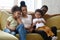 African american smiling family with two children having good time.