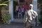 African american soldier father in front of wife, children and father greeting him outside house