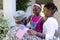 African american soldier father greeting smiling son and daughter in front of house