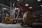 African american sports guy with naked torso exercising squat with barbell and weights in gym. Strength training