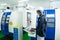 African American technician engineer operating CNC milling cutting machine in manufacturing workshop