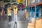African American warehouse man and woman or factory worker work and discuss together about product box that man holding and walk