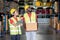 African American warehouse man and woman or factory worker work and discuss together about product box that man holding and walk