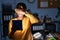 African american woman with braids working at the office at night with tablet covering eyes with hand, looking serious and sad