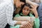 african american woman calming irritated daughter