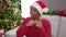 African american woman celebrating christmas dancing at home