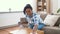 African american woman cleaning table at home