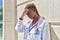 African american woman doctor stressed leaning on wall at hospital