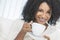 African American Woman Drinking Coffee or Tea