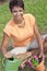 African American Woman Gardening Planting Flowers