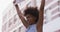 African american woman holding placard shouting during protest