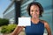 African american woman holds a business card