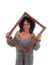 African American woman looking trough picture frame.