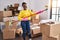 African american woman playing mop as a guitar cleaning at new home