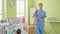 African american woman professional cleaner standing with serious face at laundry room