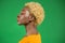 African american woman in profile isolated on green background. Black Women Protection Rights Concept, Strong Women