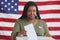 African-American Woman Putting Vote in Ballot Box