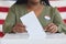 African-American Woman Putting Vote in Ballot Box Close up