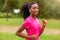 African american woman runner jogging outdoors - Fitness, peopl