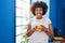 African american woman smiling confident drinking coffee at home