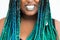 African American Woman Sneering with Beautiful Teal Green Blue Braids