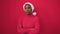 African american woman standing upset wearing christmas hat over isolated red background