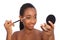 African american woman using eye shadow brush