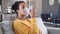 African american woman using nebulizer inhaler at home