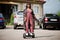 African american woman using segway or hoverboard