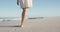 African American woman walking seaside