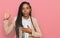 African american woman wearing business jacket swearing with hand on chest and open palm, making a loyalty promise oath